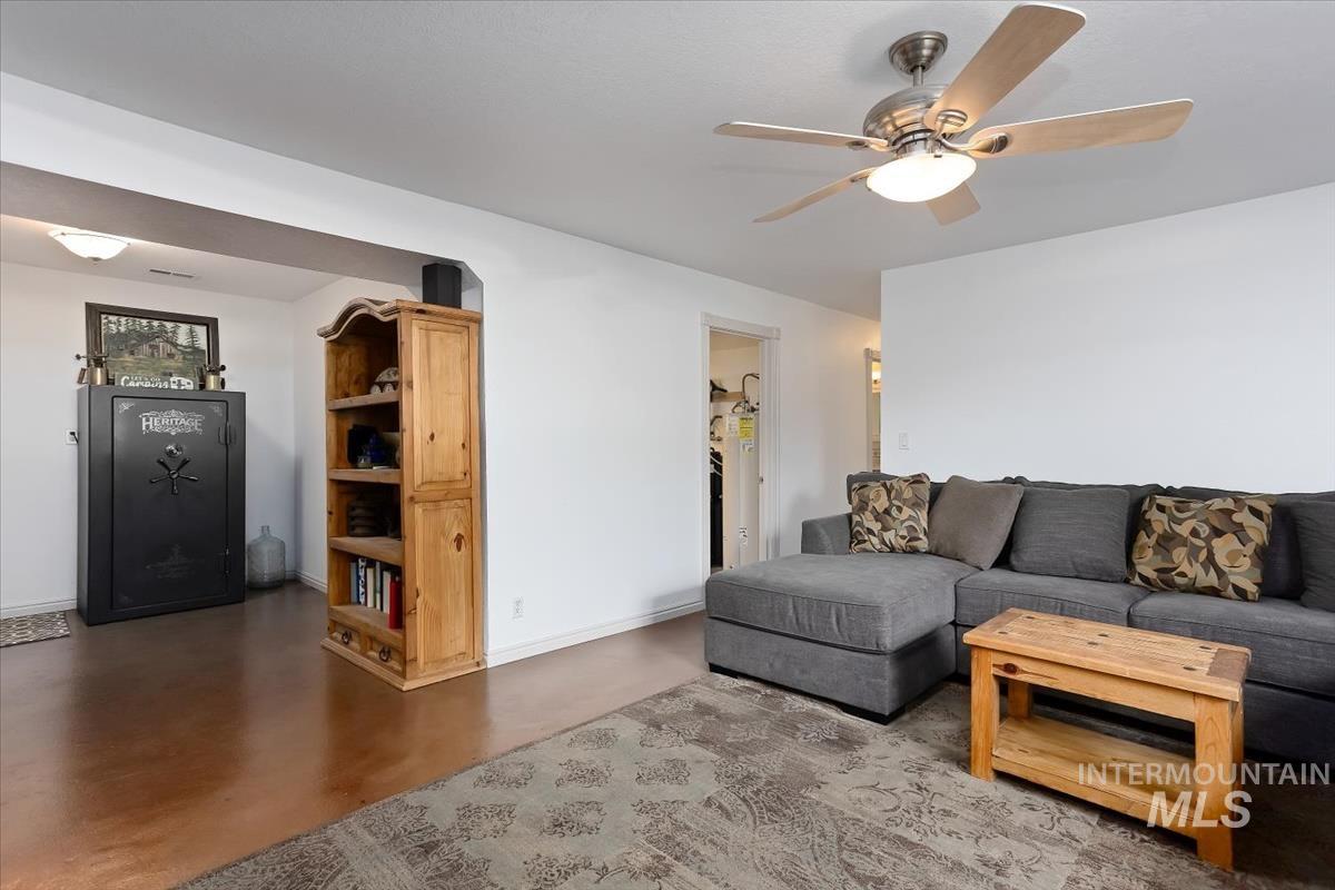 4870 North Farrow Street Boise, ID 83713 - Photo 19 of 40 Living room featuring concrete floors and a ceiling fan