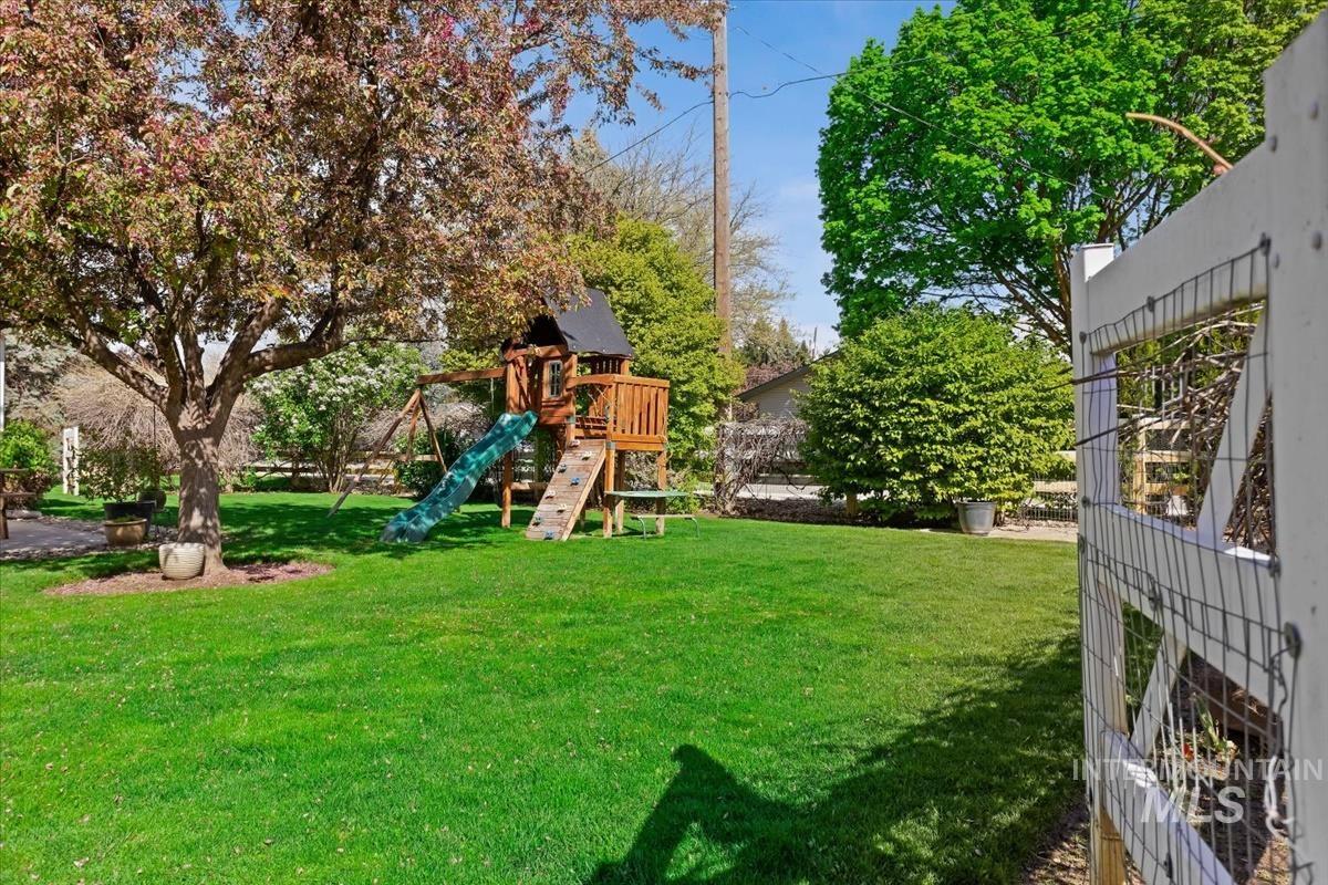 4870 North Farrow Street Boise, ID 83713 - Photo 29 of 40 View of green lawn featuring a playground