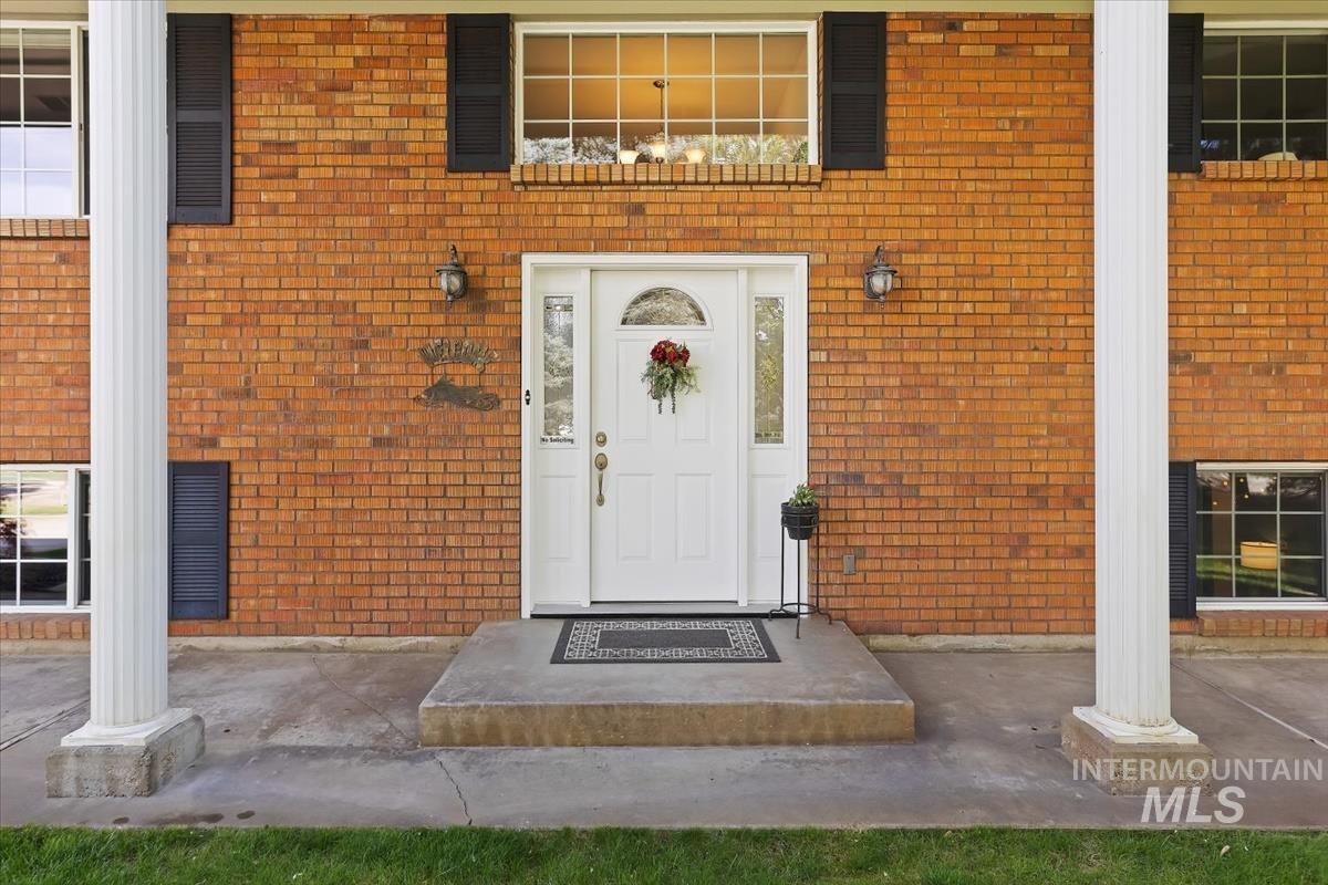4870 North Farrow Street Boise, ID 83713 - Photo 3 of 40 Doorway to property featuring brick siding