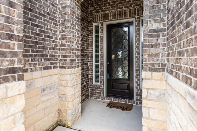 a view of wooden floor and windows in a room
