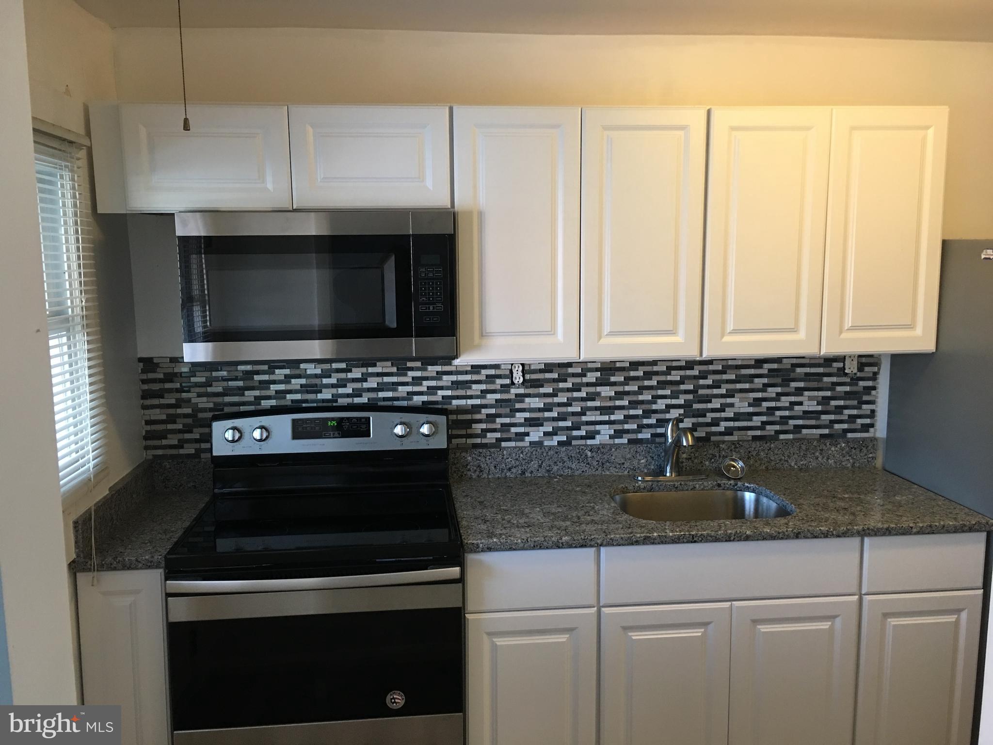 627 Aldworth Road Baltimore, MD 21222 - Photo 3 of 14 Kitchen with updated appliances and granite