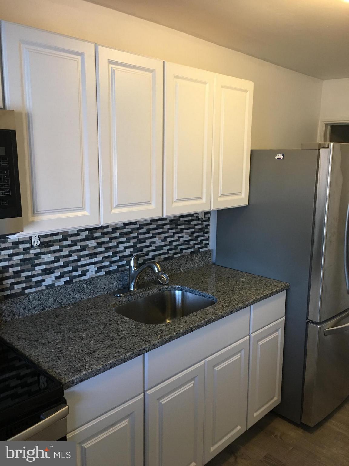 627 Aldworth Road Baltimore, MD 21222 - Photo 4 of 14 Kitchen with beautiful back splash