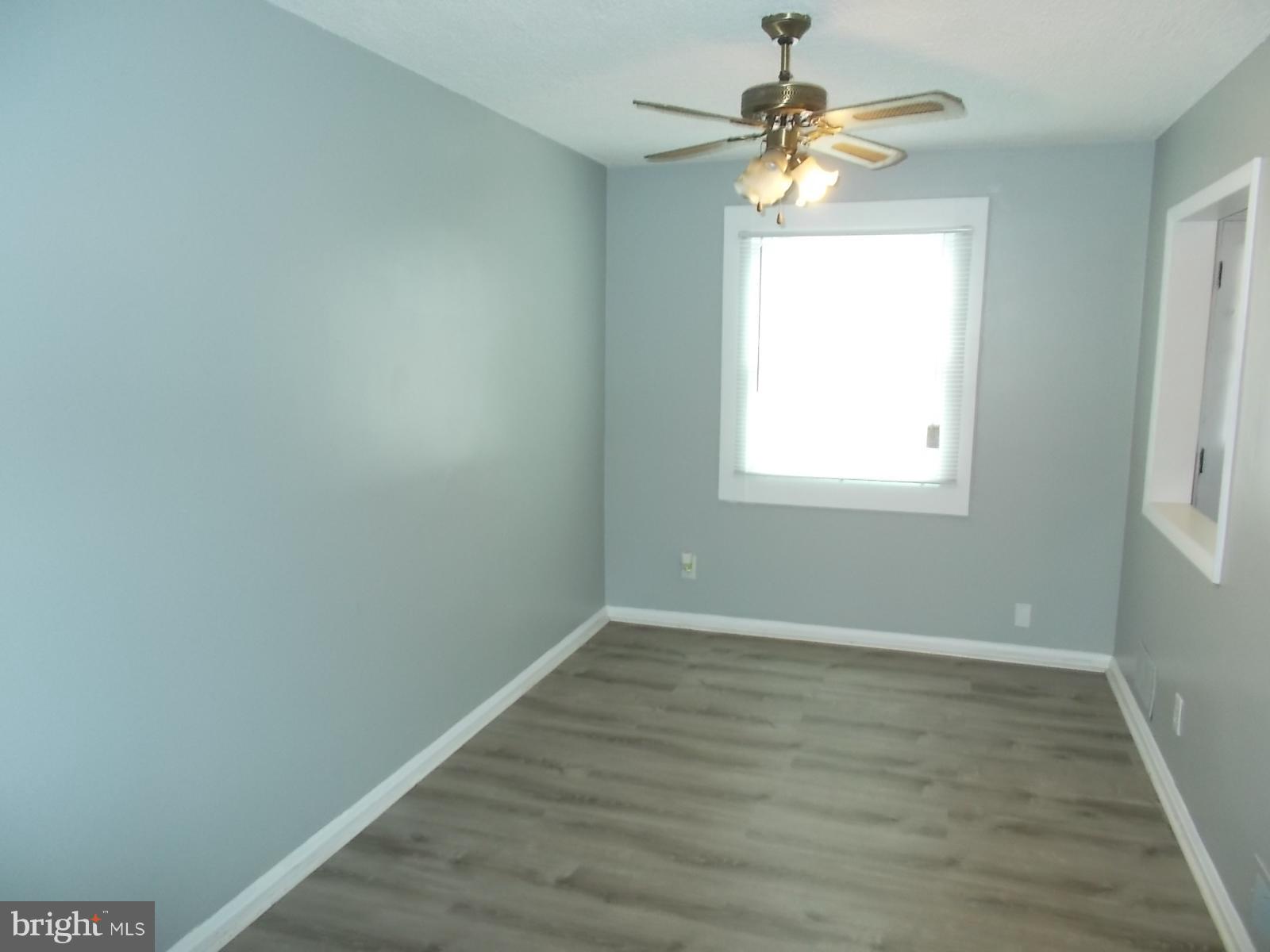 627 Aldworth Road Baltimore, MD 21222 - Photo 6 of 14 Dining Room with New Laminate Floors