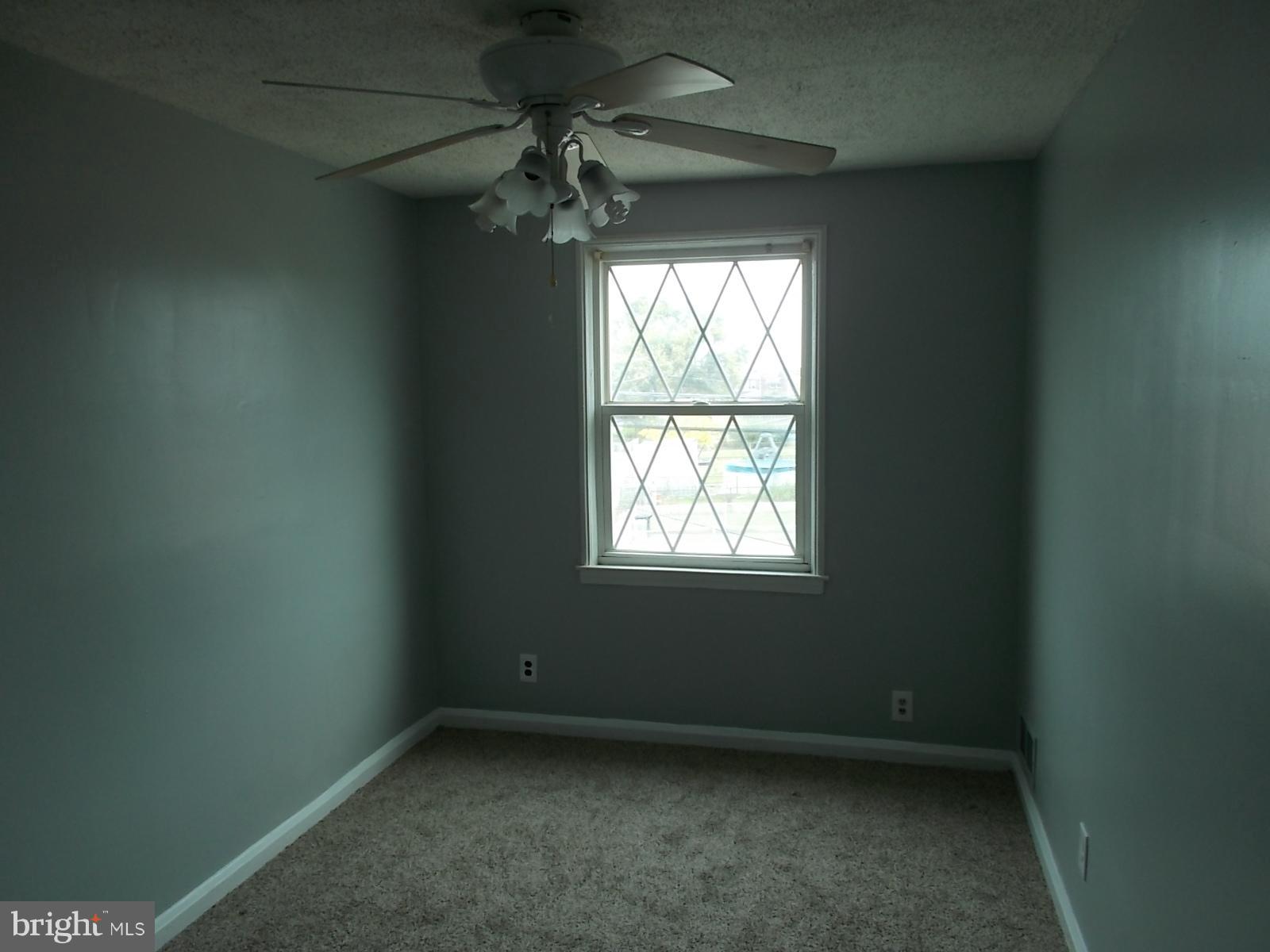 627 Aldworth Road Baltimore, MD 21222 - Photo 10 of 14 Second Bedroom with new carpet and freshly painted
