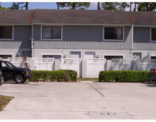 a view of building with car parked