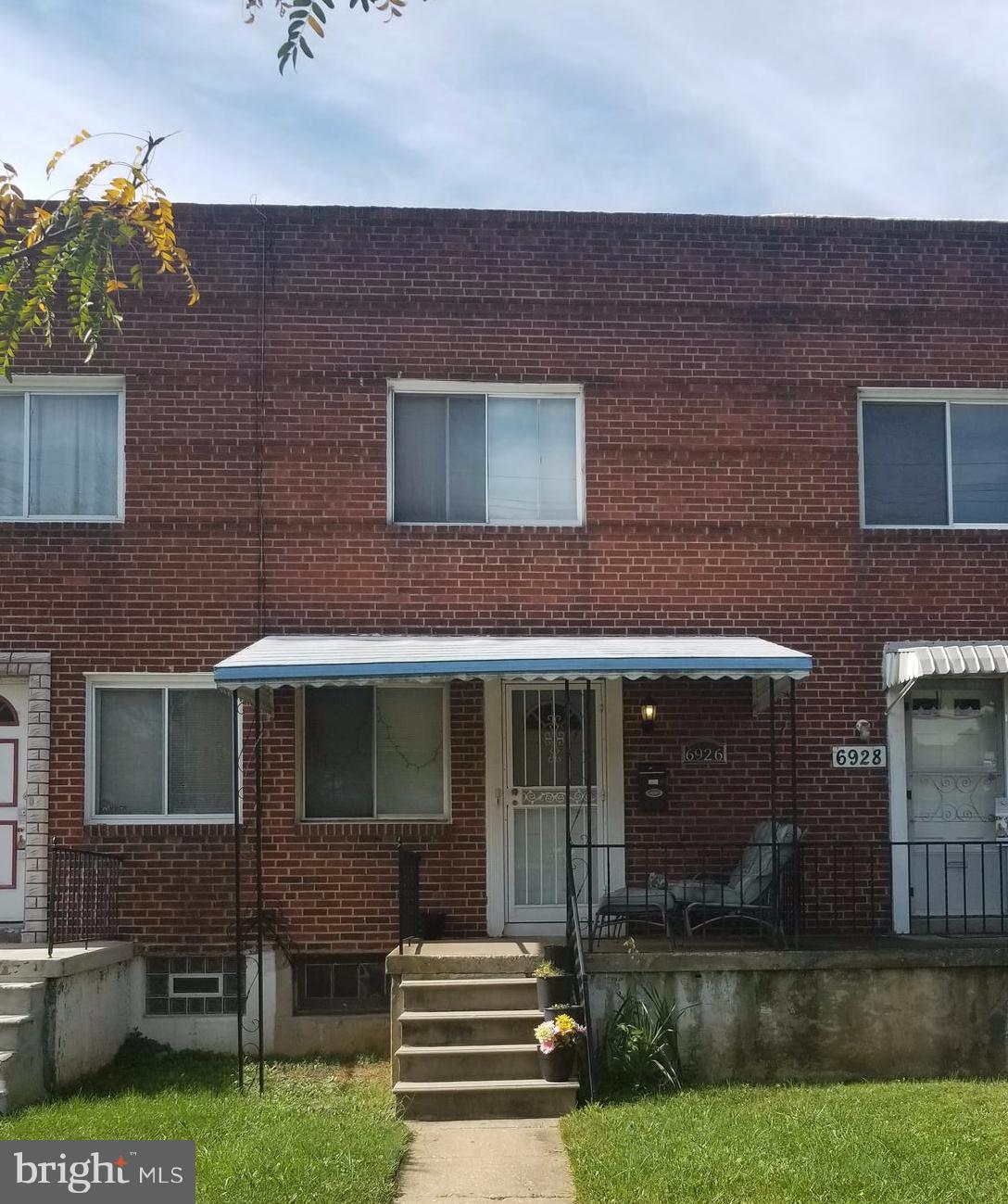 6926 Reisterstown Road Baltimore, MD 21215 - Photo 1 of 1 a front view of a house with a yard