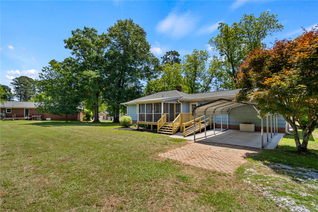 1509 869 Anderson, SC 29621 - Photo 40 of 45 A well-maintained property features a spacious yard and convenient covered parking.