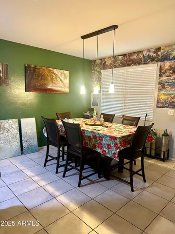 a outdoor dining space with furniture and window