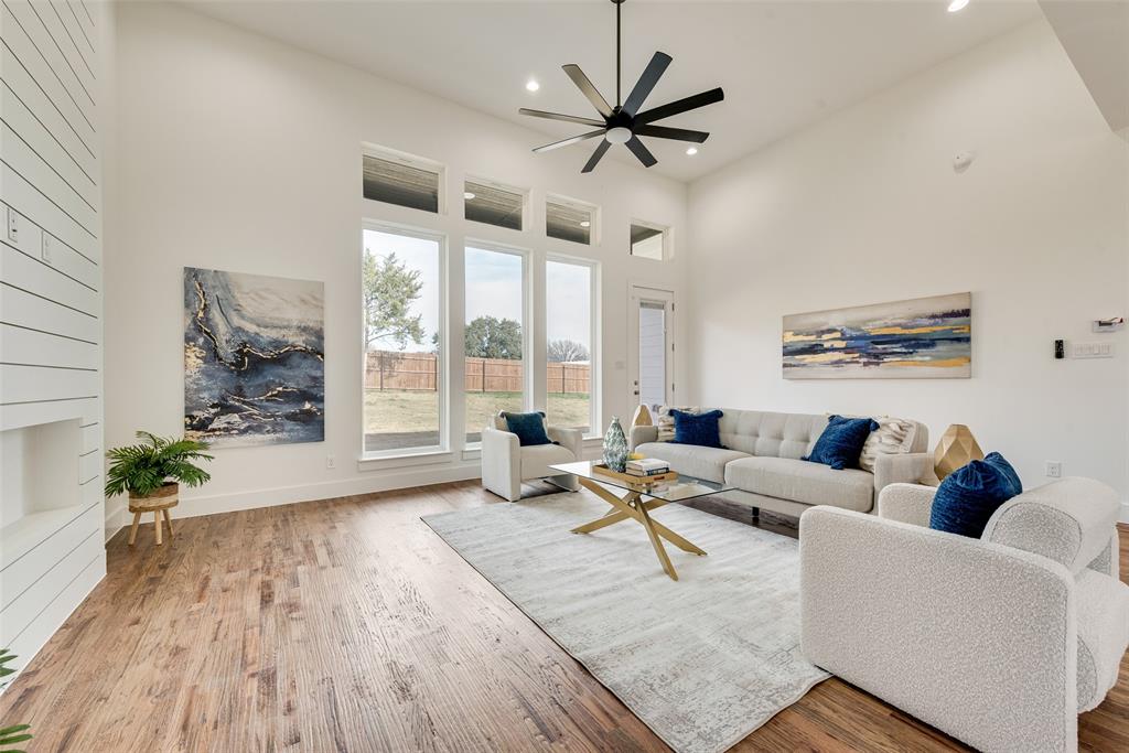 539 West Laureland Road Dallas, TX 75232 - Photo 11 of 37 a living room with furniture and a large window