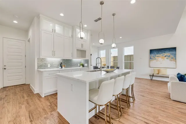 a kitchen with a sink and cabinets