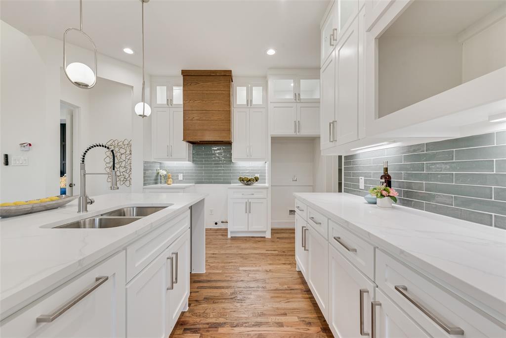 539 West Laureland Road Dallas, TX 75232 - Photo 16 of 37 a kitchen with a sink and cabinets