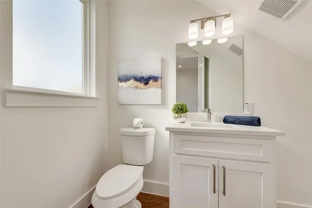 a kitchen with white cabinets