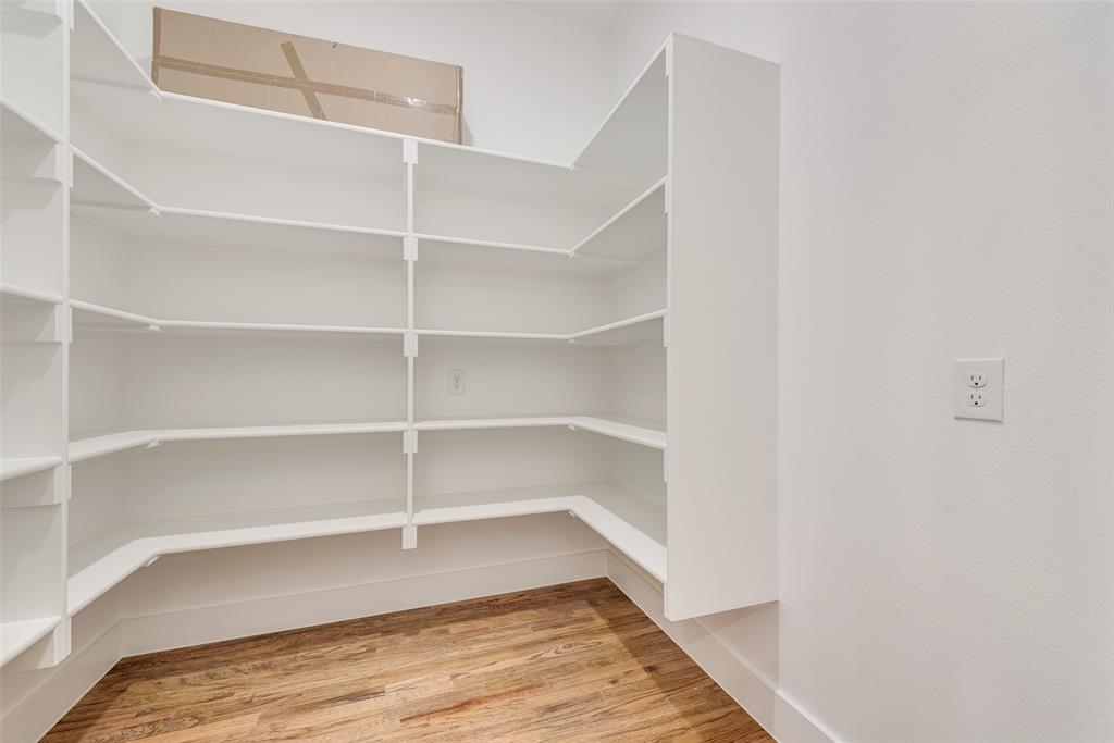 539 West Laureland Road Dallas, TX 75232 - Photo 22 of 37 a view of a room with shelf on the wall