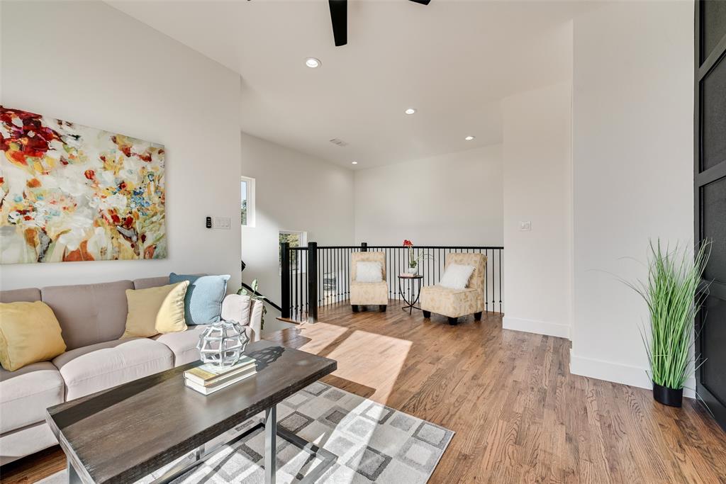539 West Laureland Road Dallas, TX 75232 - Photo 29 of 37 a living room with furniture and wooden floor