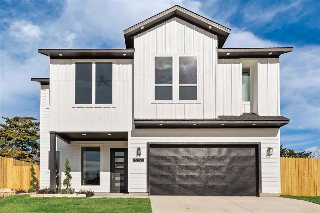 539 West Laureland Road Dallas, TX 75232 - Photo 3 of 37 a front view of a house with garden
