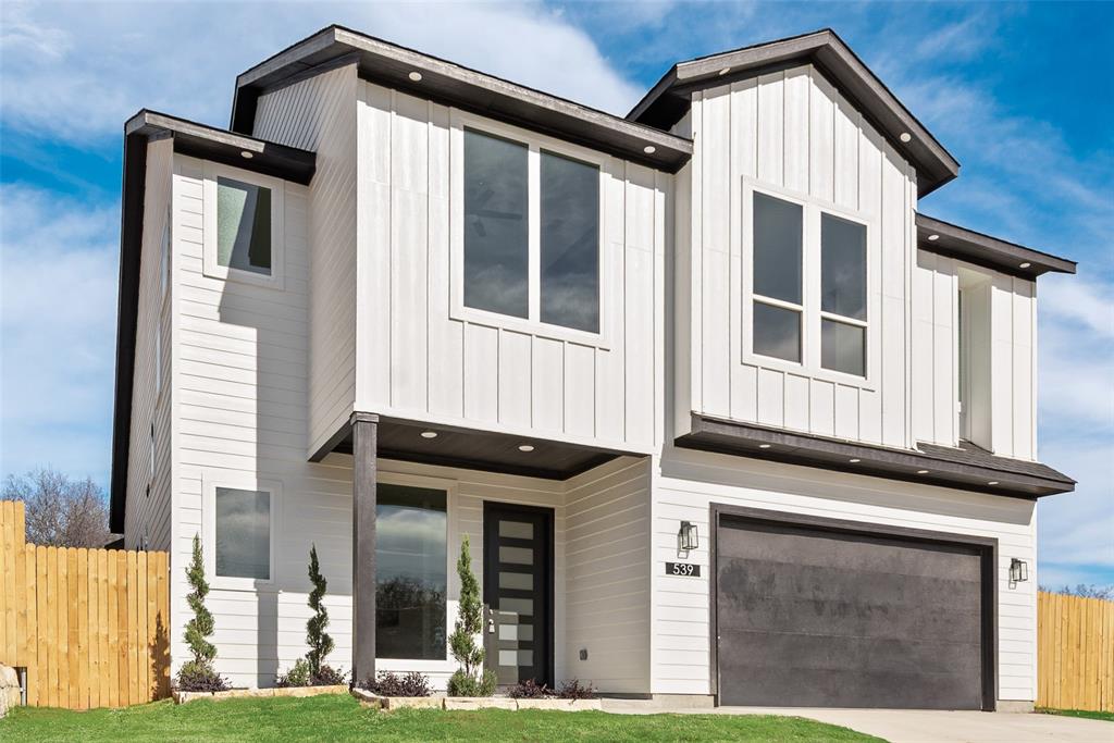 539 West Laureland Road Dallas, TX 75232 - Photo 5 of 37 a front view of a house with a yard