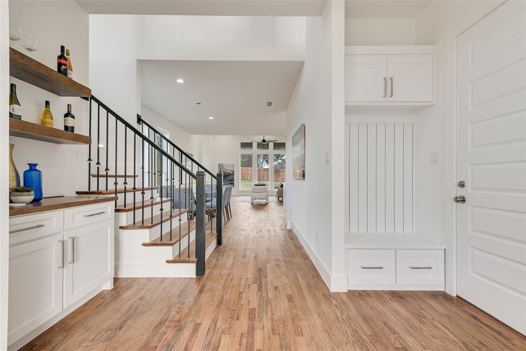 539 West Laureland Road Dallas, TX 75232 - Photo 8 of 37 a view of a hallway with wooden floor and staircase