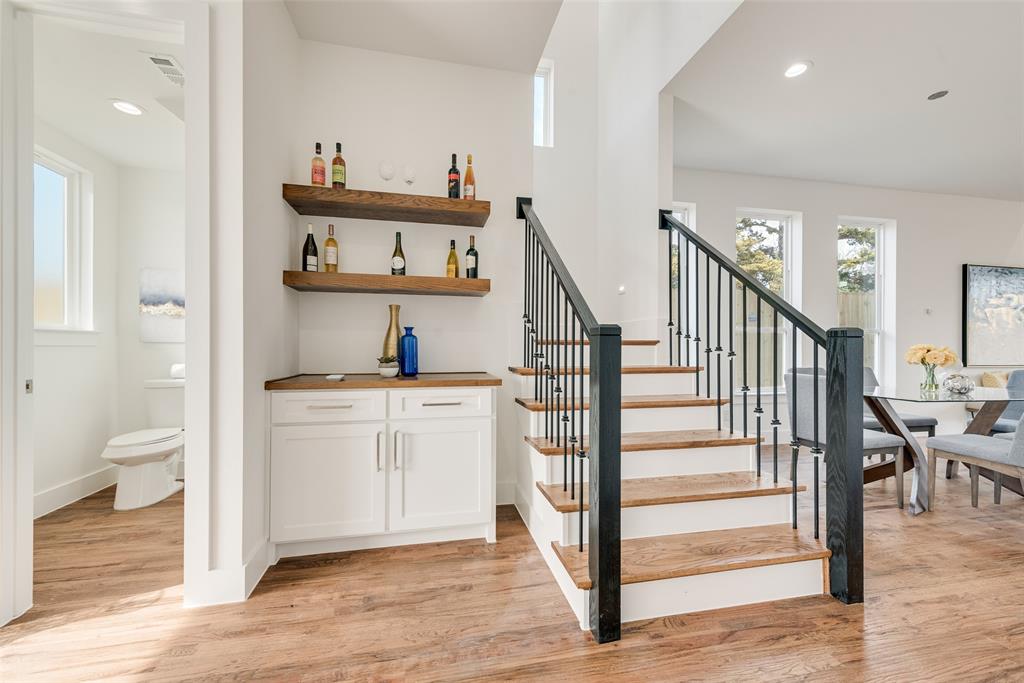 539 West Laureland Road Dallas, TX 75232 - Photo 9 of 37 a view of a hallway with entryway and wooden floor