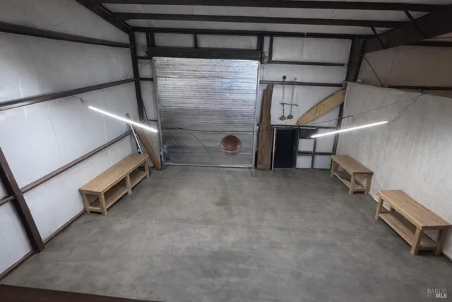 a view of an empty room with a staircase