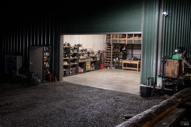 a room with lots of wooden furniture and a potted plant