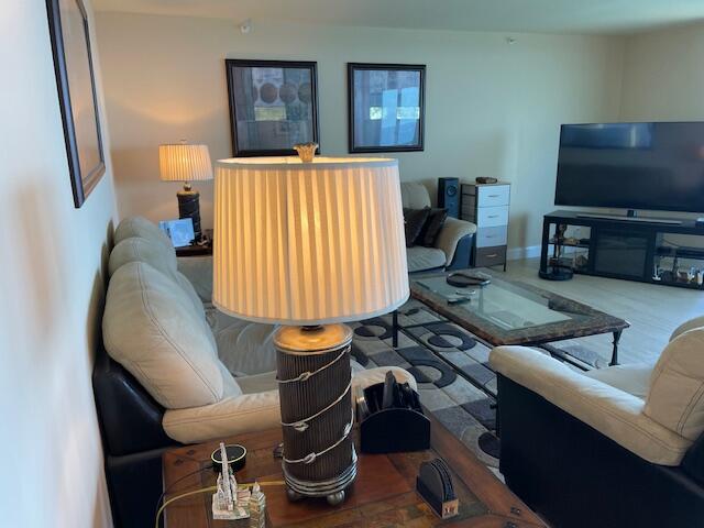 250 South Ocean Boulevard, Unit 11B Boca Raton, FL 33432 - Photo 13 of 47 a living room with furniture and a flat screen tv