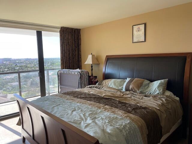 250 South Ocean Boulevard, Unit 11B Boca Raton, FL 33432 - Photo 19 of 47 a bed sitting in a bedroom next to a window