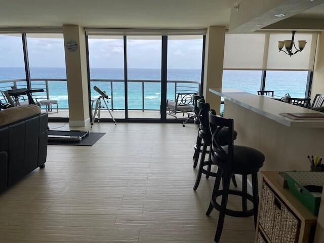 250 South Ocean Boulevard, Unit 11B Boca Raton, FL 33432 - Photo 3 of 47 a room with gym equipment and large window