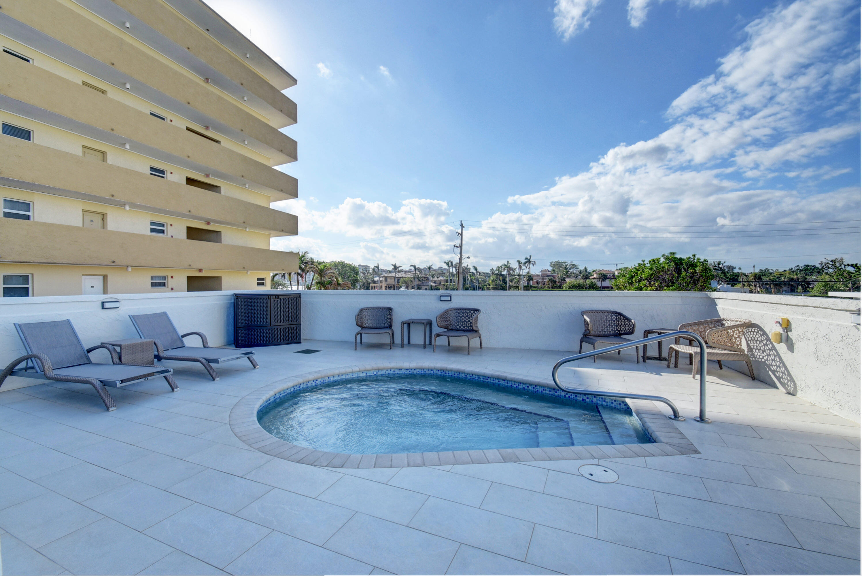 250 South Ocean Boulevard, Unit 11B Boca Raton, FL 33432 - Photo 31 of 47 a roof deck with couches and a potted plant