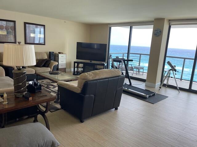 250 South Ocean Boulevard, Unit 11B Boca Raton, FL 33432 - Photo 4 of 47 a living room with furniture and a flat screen tv