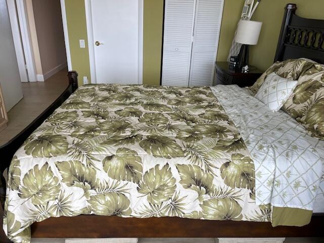 250 South Ocean Boulevard, Unit 11B Boca Raton, FL 33432 - Photo 44 of 47 a bedroom with a bed and a mirror