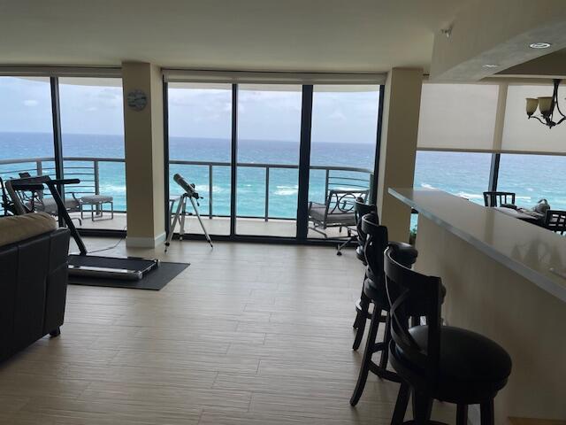 250 South Ocean Boulevard, Unit 11B Boca Raton, FL 33432 - Photo 7 of 47 a view of a room with gym equipment and floor to ceiling window