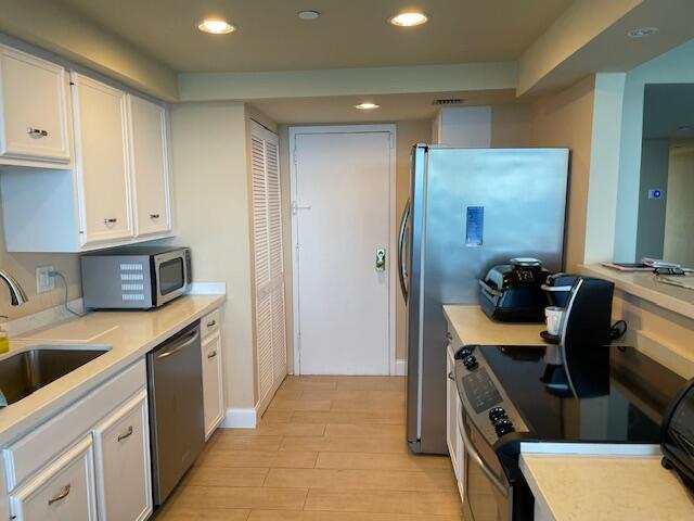 250 South Ocean Boulevard, Unit 11B Boca Raton, FL 33432 - Photo 9 of 47 a view of a kitchen with a sink