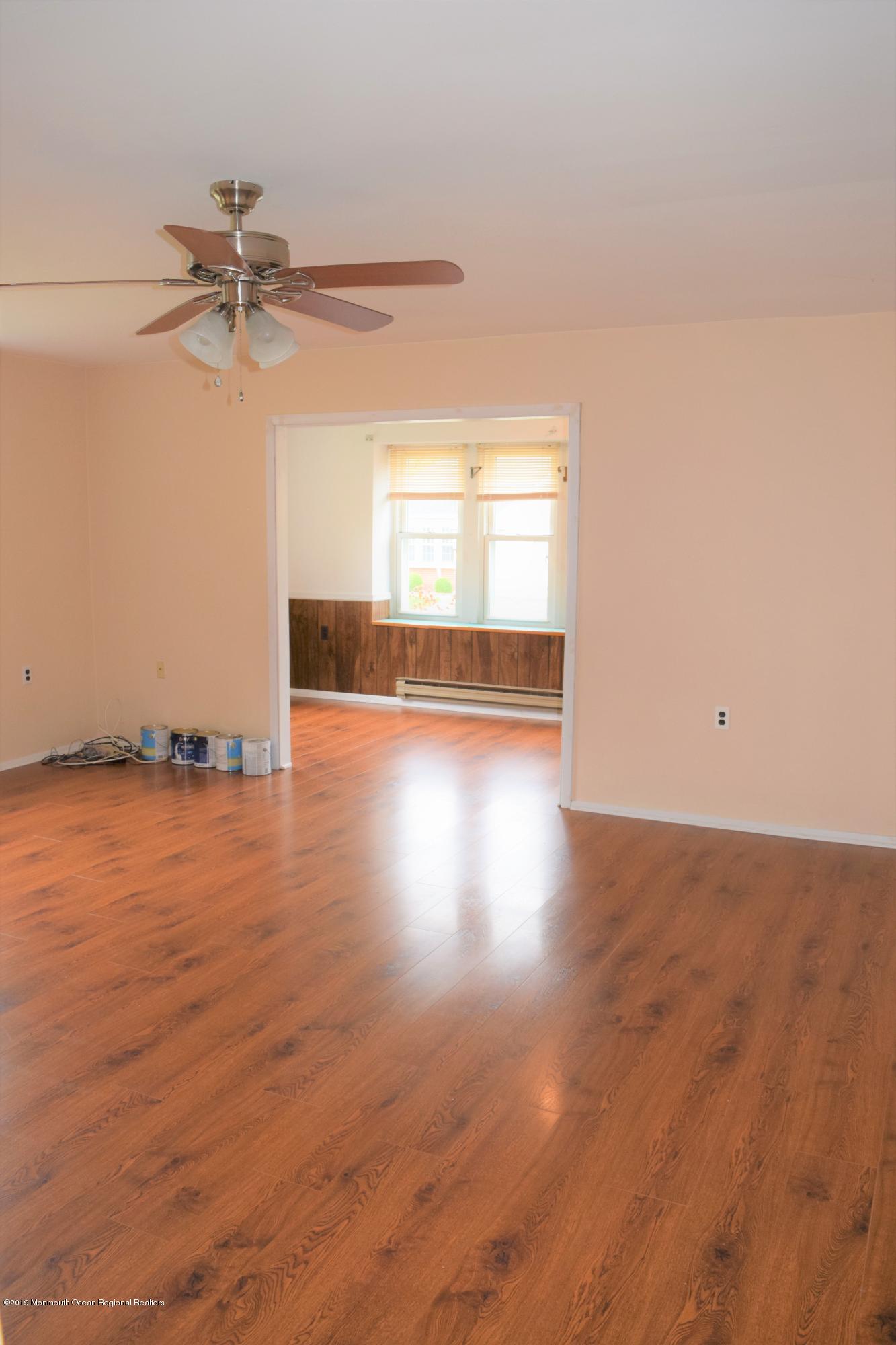 9 B Sunset Road Whiting, NJ 08759 - Photo 37 of 54 an empty room with wooden floor fan and windows