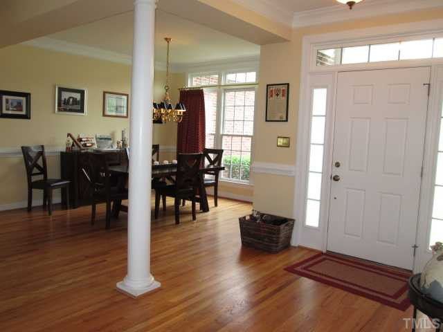 8120 Standing Stone Court Raleigh, NC 27613 - Photo 9 of 25 The lovely foyer entry features hardwood flooring and is nice and open to the home and makes it great for when you have guests so everyone can move about freely. Glass transom and sidelights around front door. Foyer