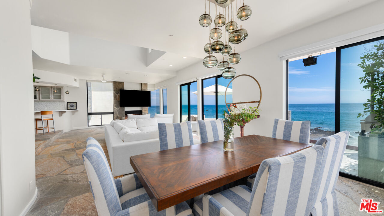25252 Malibu Road Malibu, CA 90265 - Photo 20 of 62 a view of a dining room with furniture window and wooden floor