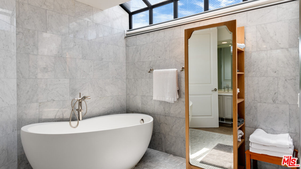 25252 Malibu Road Malibu, CA 90265 - Photo 28 of 62 a white bath tub sitting next to a white sink