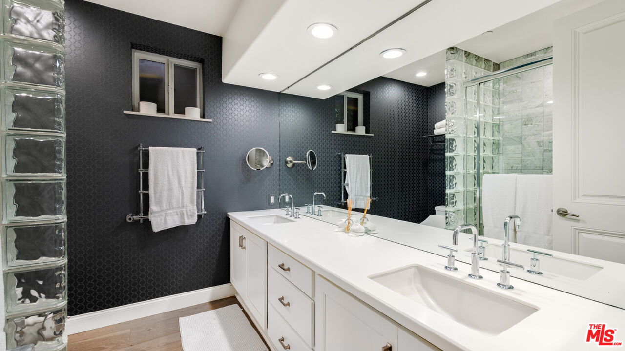25252 Malibu Road Malibu, CA 90265 - Photo 50 of 62 a bathroom with a sink double vanity and a mirror