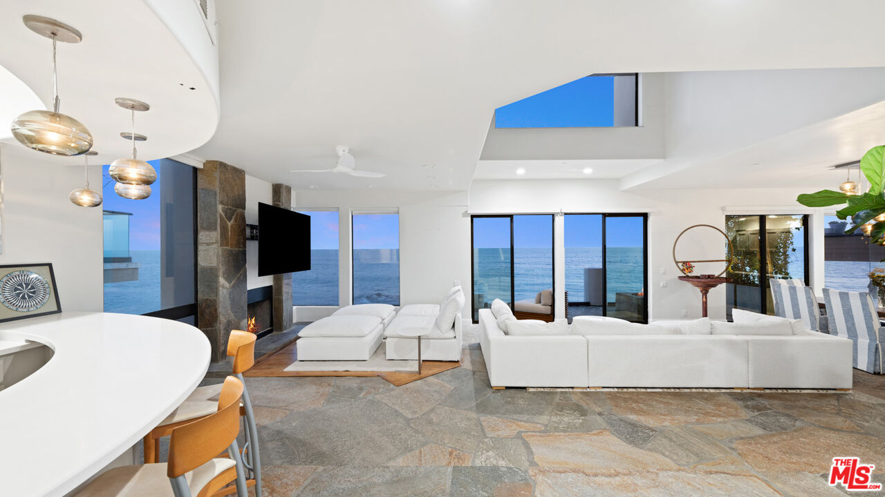 25252 Malibu Road Malibu, CA 90265 - Photo 55 of 62 a living room with furniture and a flat screen tv