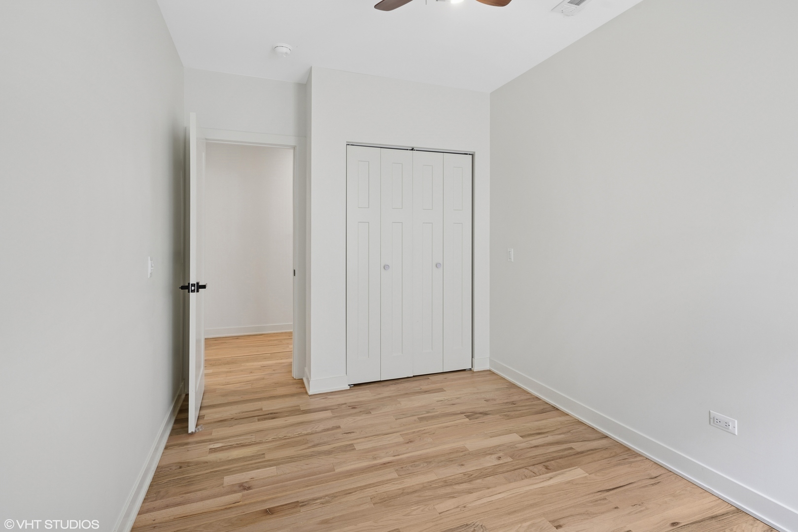 1246 South Fairfield Avenue, Unit 1 Chicago, IL 60608 - Photo 8 of 12 a view of an empty room with wooden floor