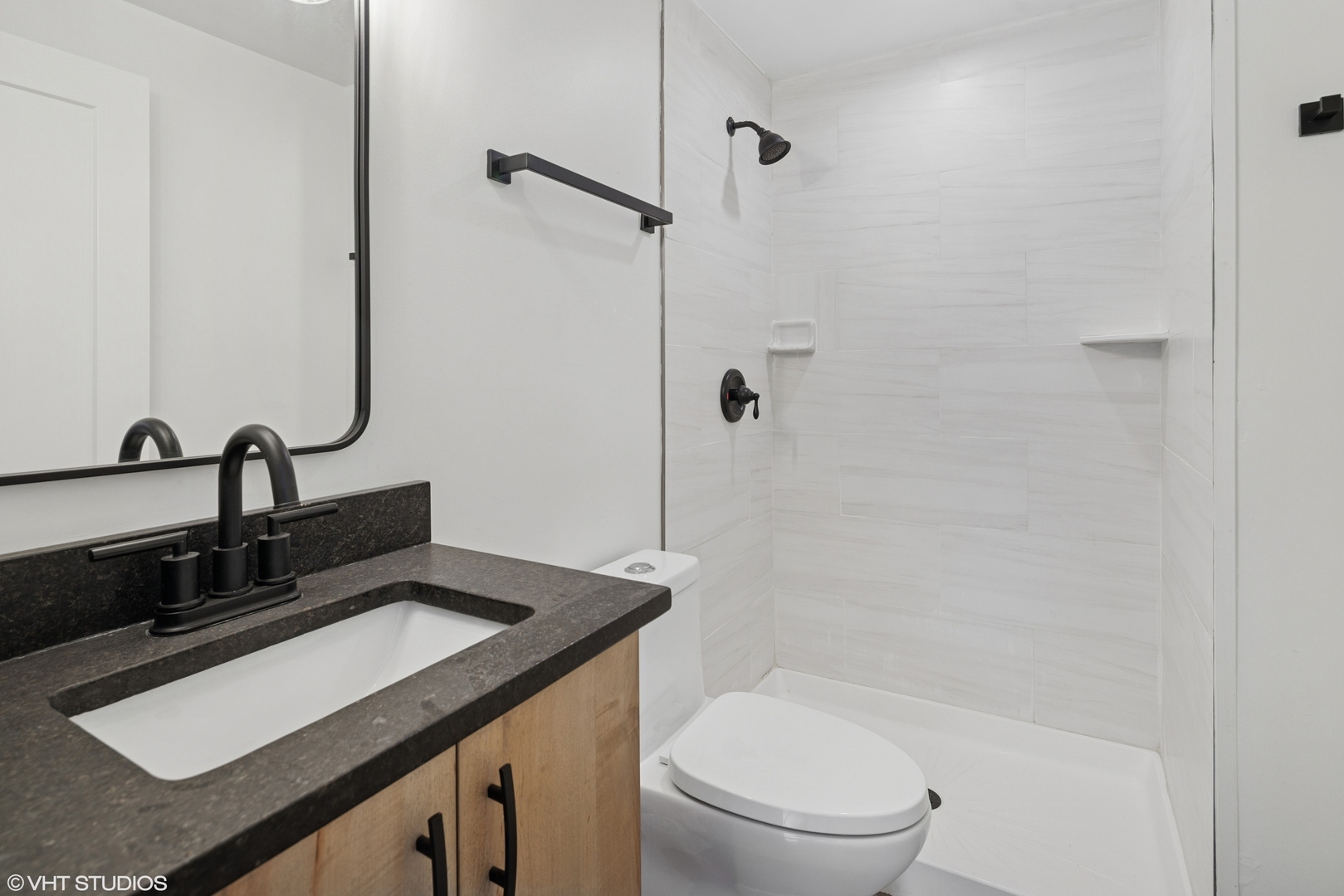 1246 South Fairfield Avenue, Unit 1 Chicago, IL 60608 - Photo 10 of 12 a bathroom with a sink a toilet and shower