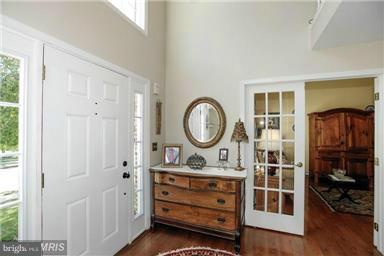 1406 Hunting Wood Road Annapolis, MD 21403 - Photo 3 of 23 a bathroom with a mirror and a sink