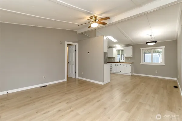 a view of an empty room with a fan