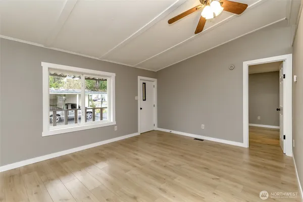 a view of an empty room with a window