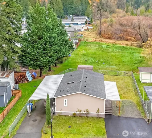 a view of a city with lush green forest