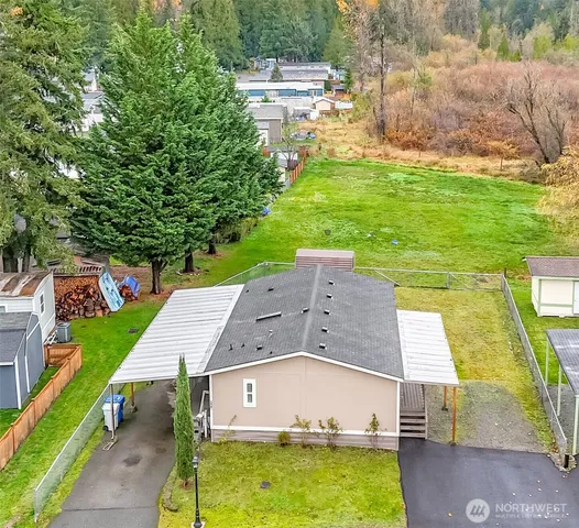 a view of a city with lush green forest