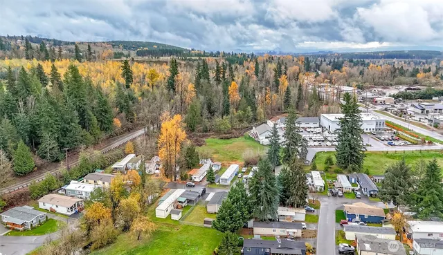 an aerial view of residential house with outdoor space and lake view