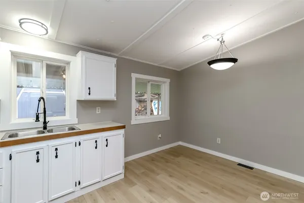 a kitchen with a sink and a window