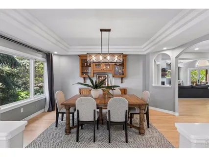 a view of a dining room with furniture window and outside view