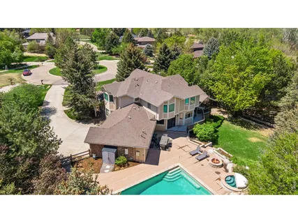 a view of a house with a backyard porch and garden