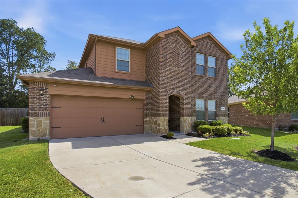 1328 Broaddus Road Forney, TX 75126 - Photo 7 of 31 Two-story brick and siding residence featuring a two-car garage